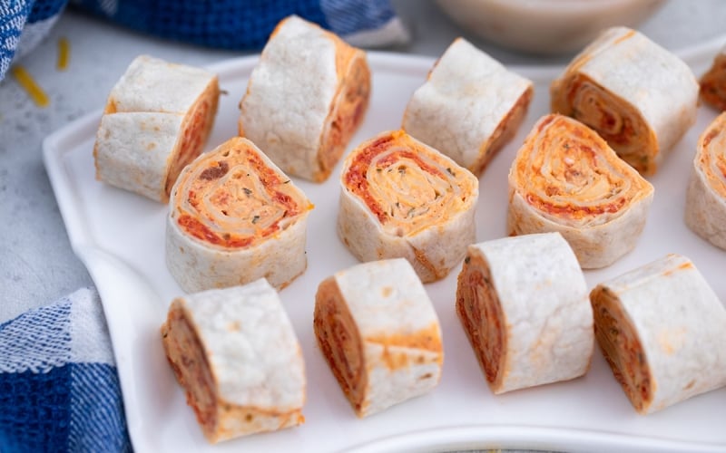 overhead shot of tray of pizza pinwheels