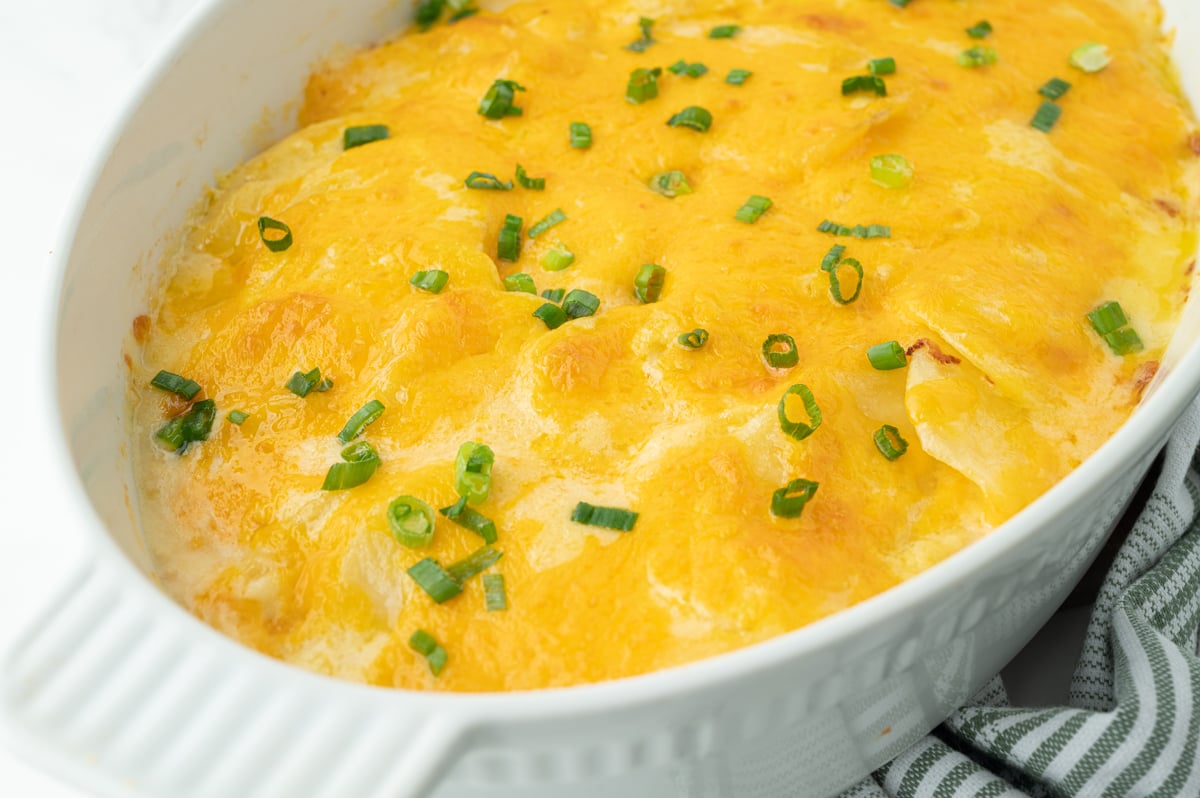 close up angled shot of au gratin potatoes in dish