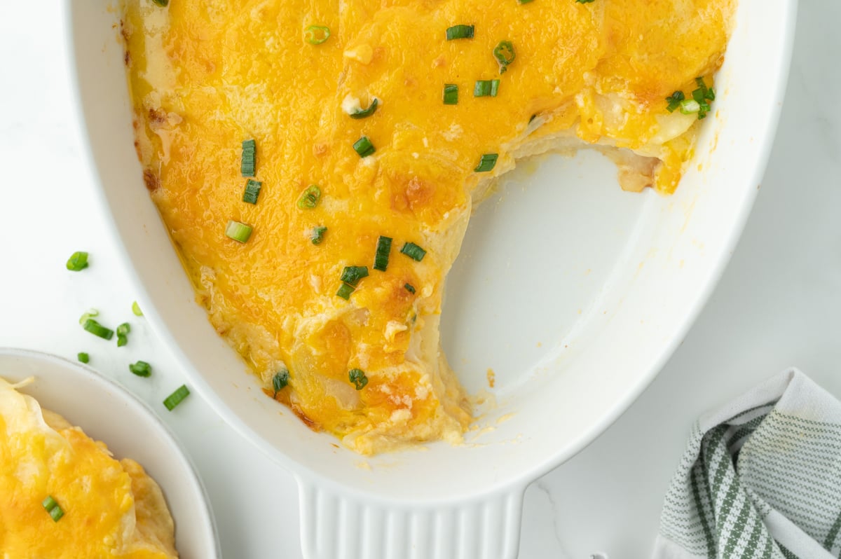 overhead shot of slice taken out of dish of au gratin potatoes