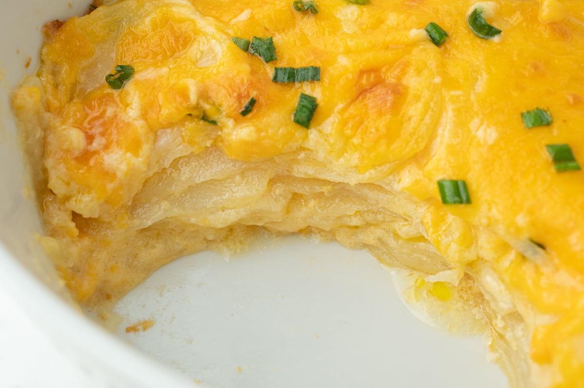 close up of slice of potatoes taken out of dish