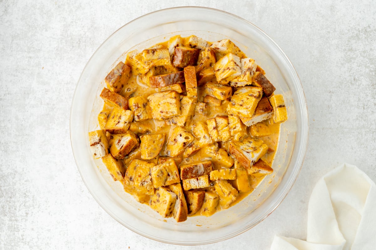 cinnamon swirl bread cubes soaking in custard