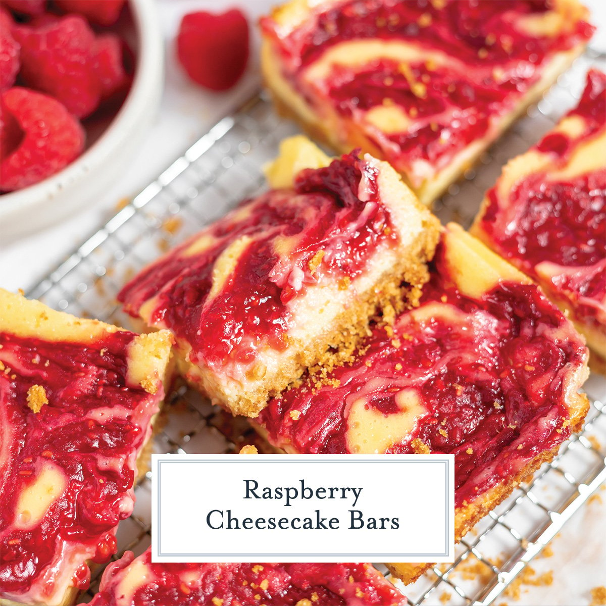close up raspberry cheesecake bars with text overlay