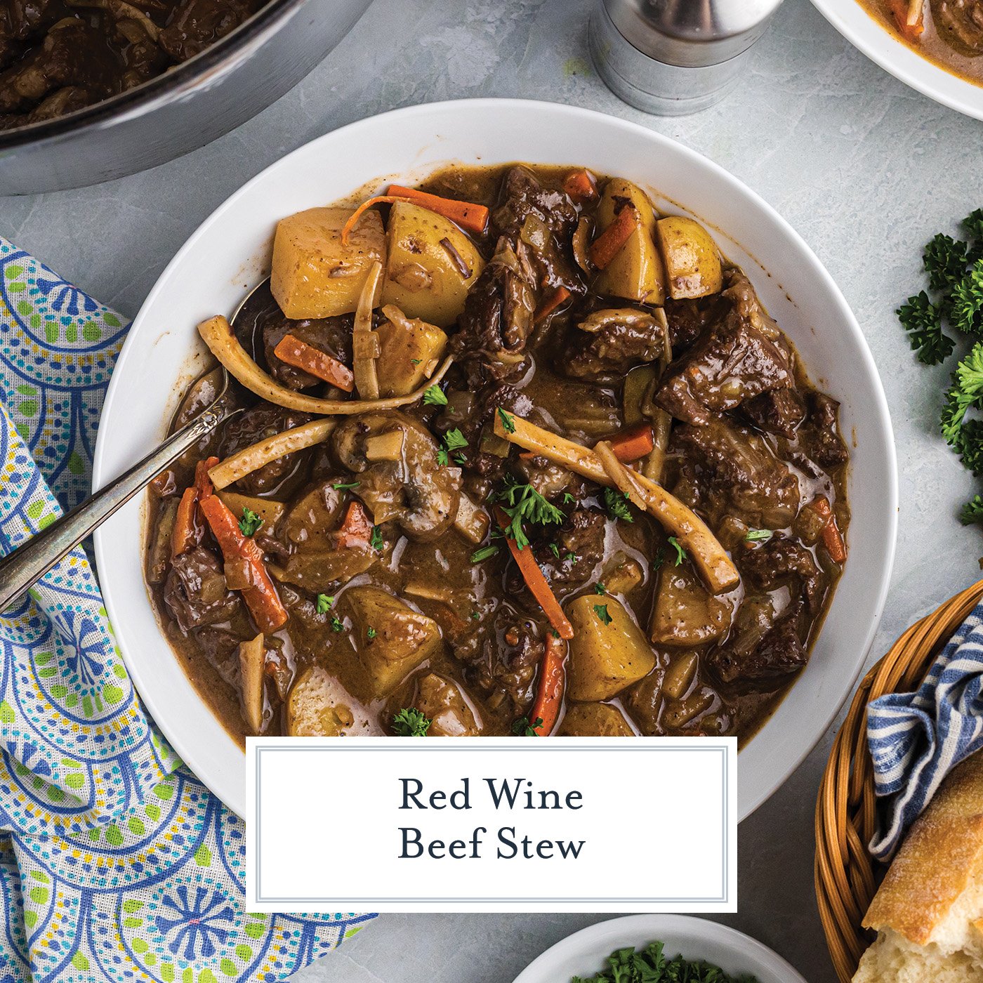 overhead shot of bowl of red wine beef stew with text overlay for facebook