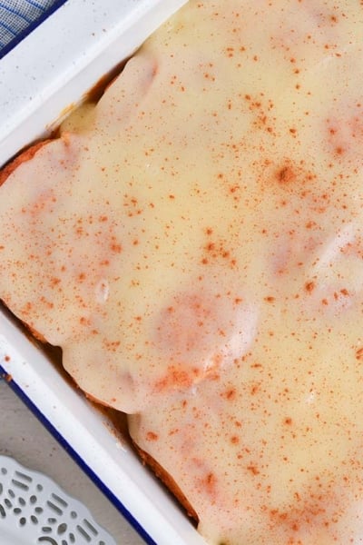 close up over head shot of tiktok cinnamon rolls in baking dish