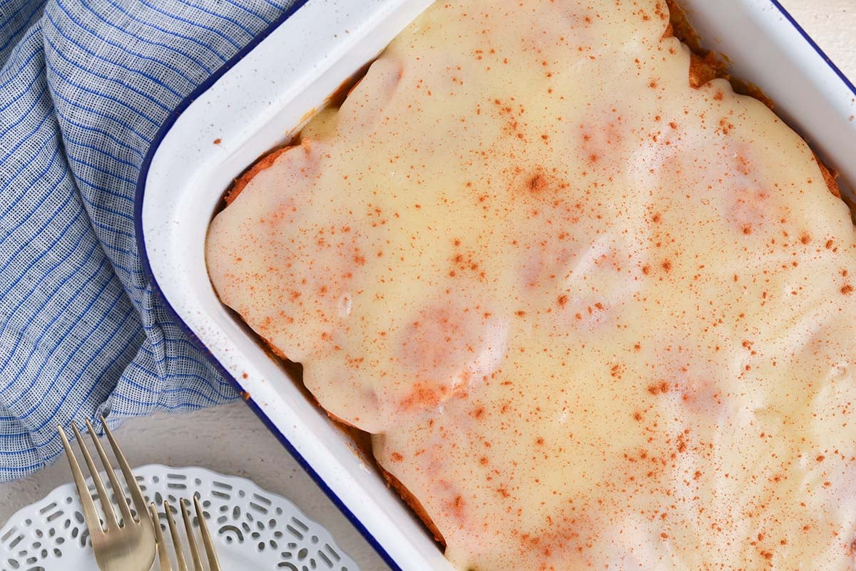 close up over head shot of tiktok cinnamon rolls in baking dish