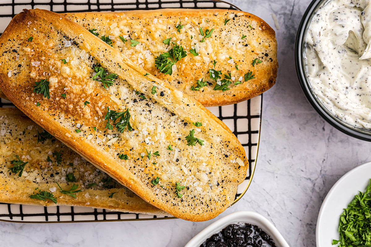 overhead shot of three pieces of truffle garlic bread