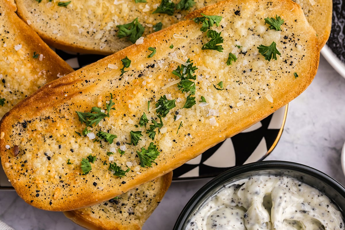 close up angled shot of piece of truffle garlic bread