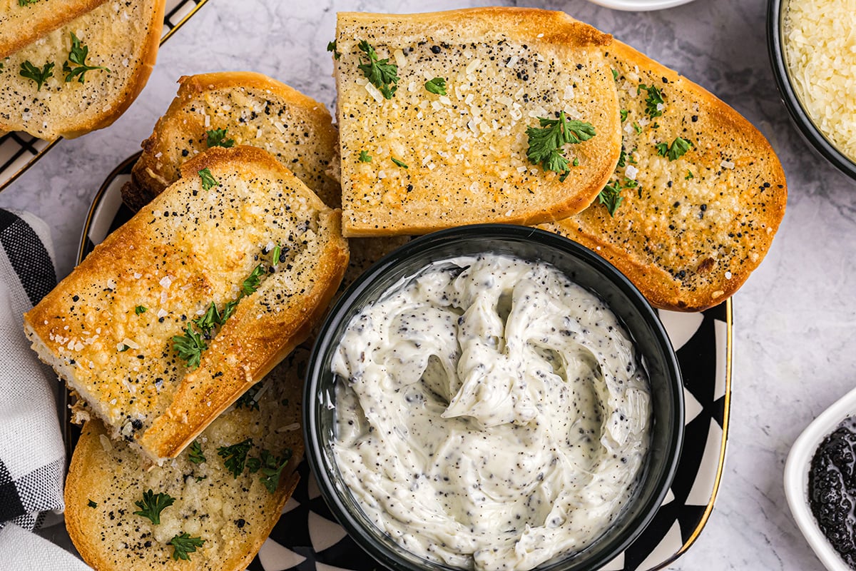 overhead shot of black truffle butter with garlic bread