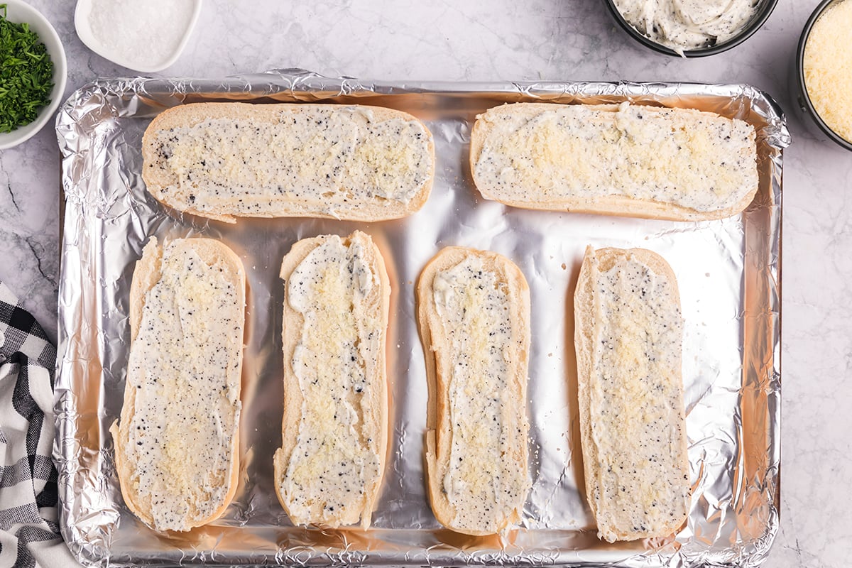 parmesan cheese sprinkled onto garlic bread