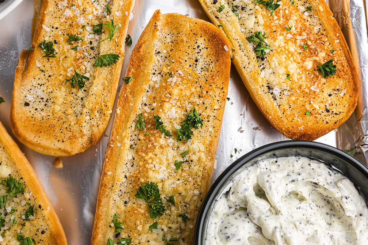 overhead shot of three loaves of truffle garlic bread