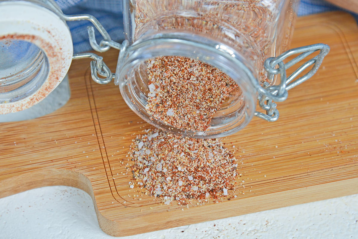 glass jar pouring our turkey seasoning blend