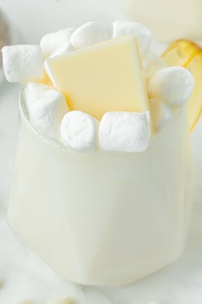 angled shot of mug of white hot chocolate