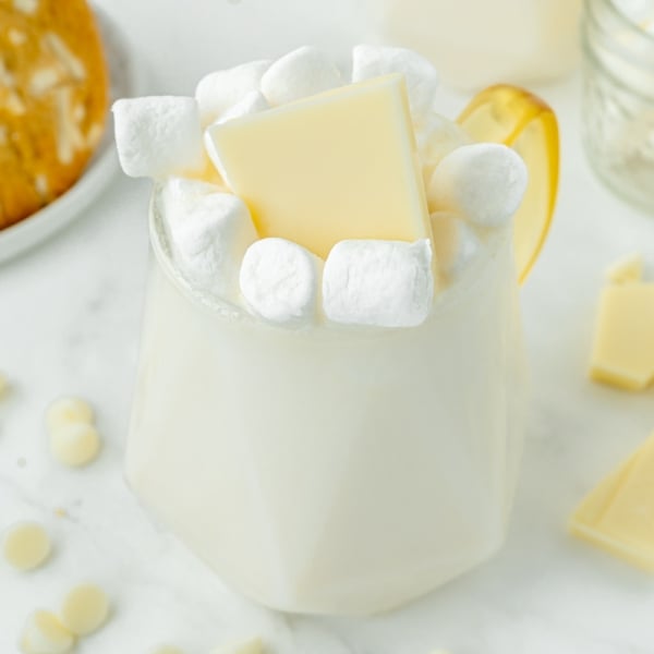 angled shot of mug of white hot chocolate