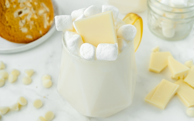 angled shot of mug of white hot chocolate