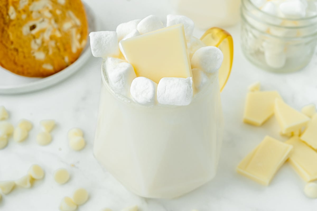 angled shot of mug of white hot chocolate