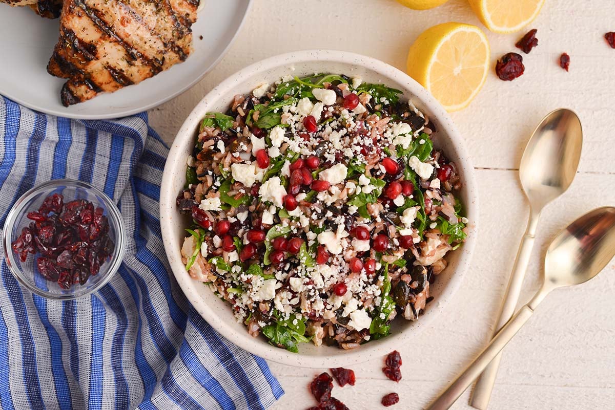 overhead shot of wild rice salad in white bowl