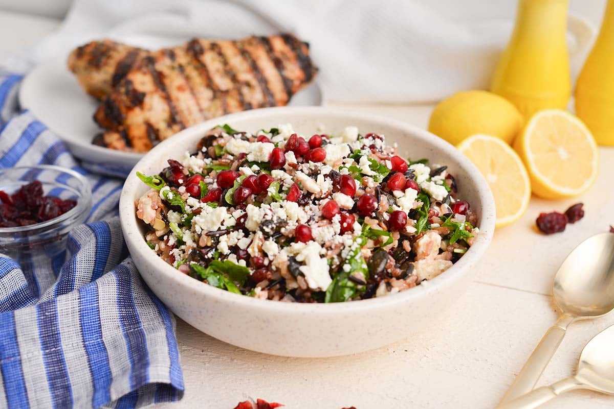 angled shot of wild rice salad in white bowl