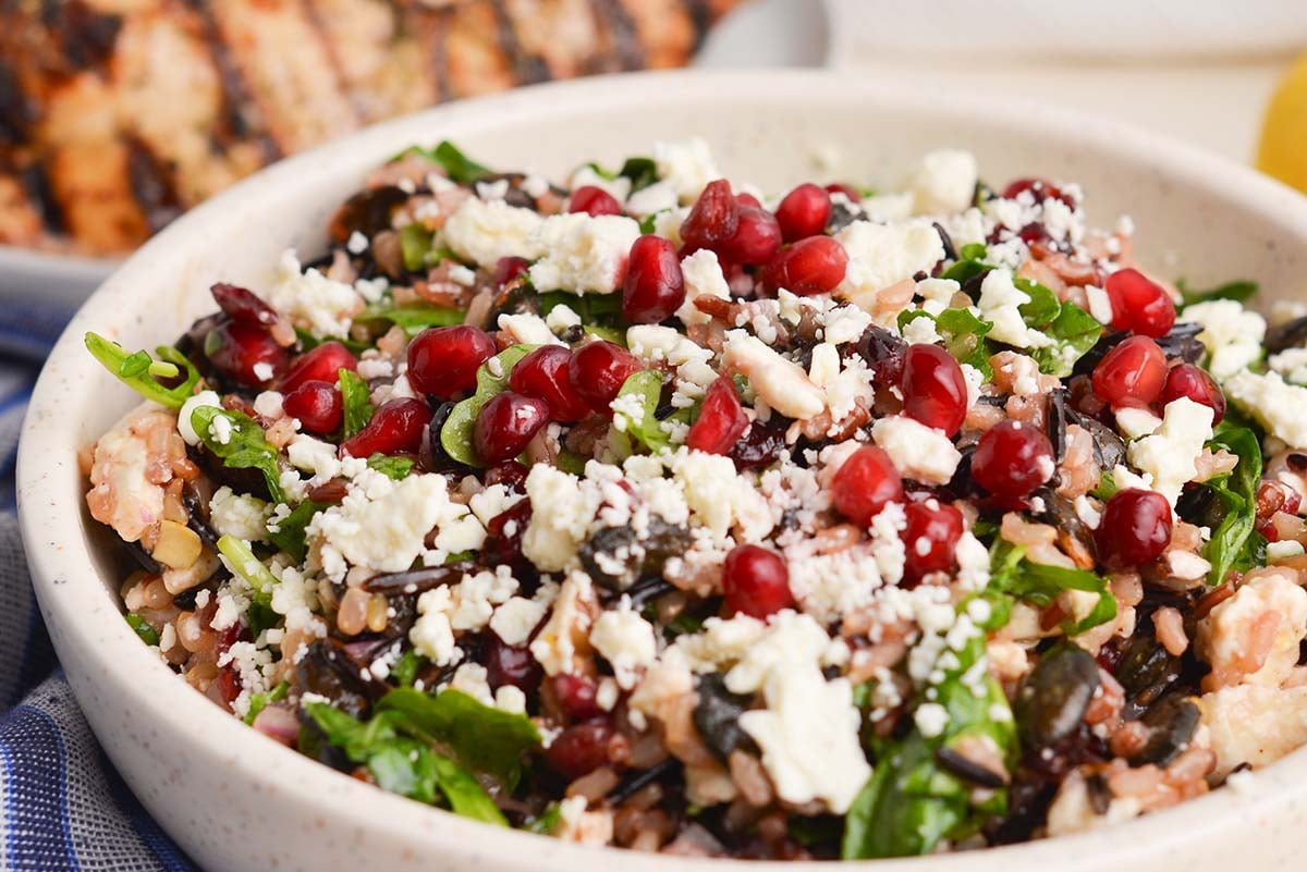 close up angled shot of bowl of wild rice salad