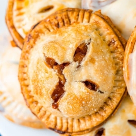 angled shot of plate of apple hand pies