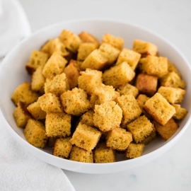 angled shot of bowl of cornbread croutons