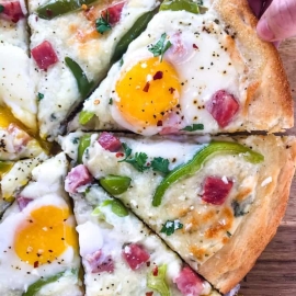 overhead shot of sliced denver omelet pizza