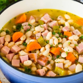angled shot of pot of ham and beans