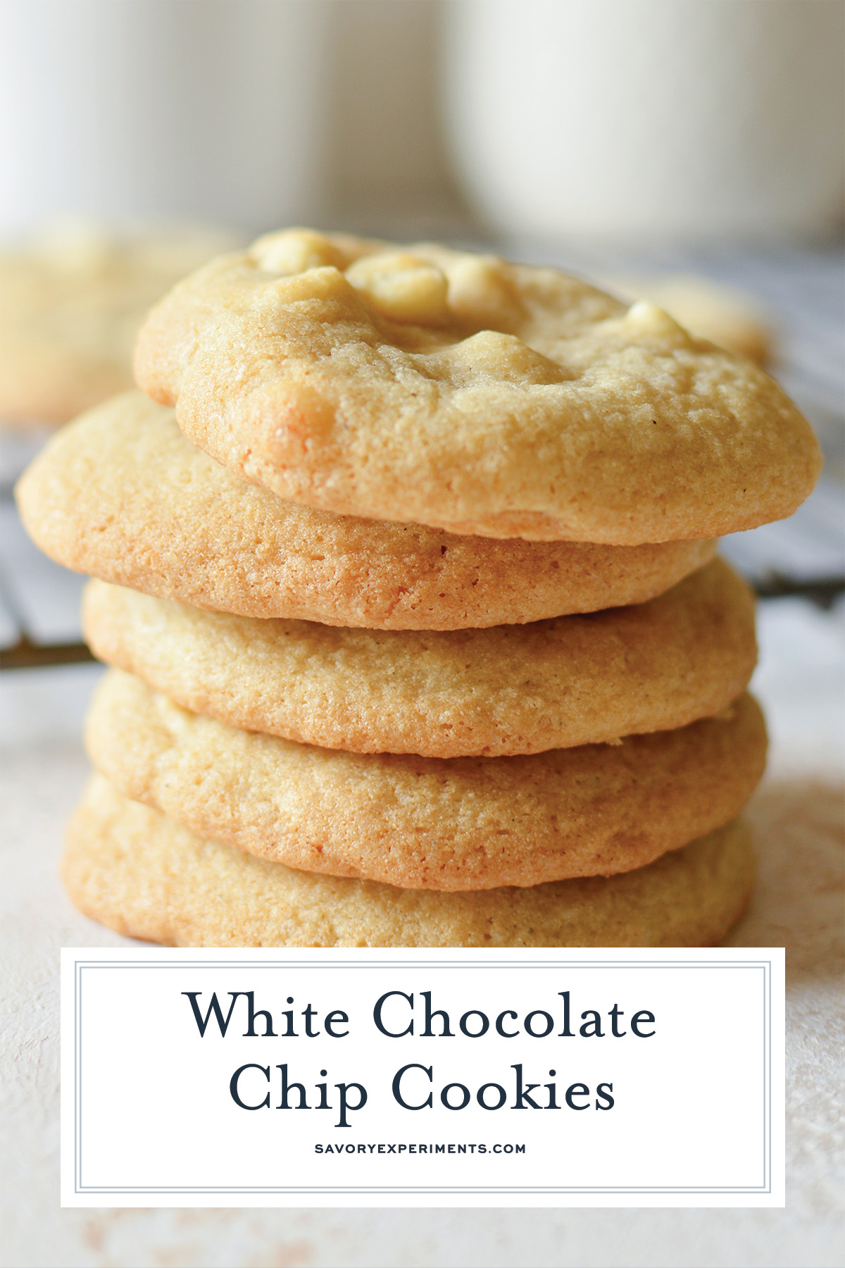 tall image of stack of white chocolate chip cookies