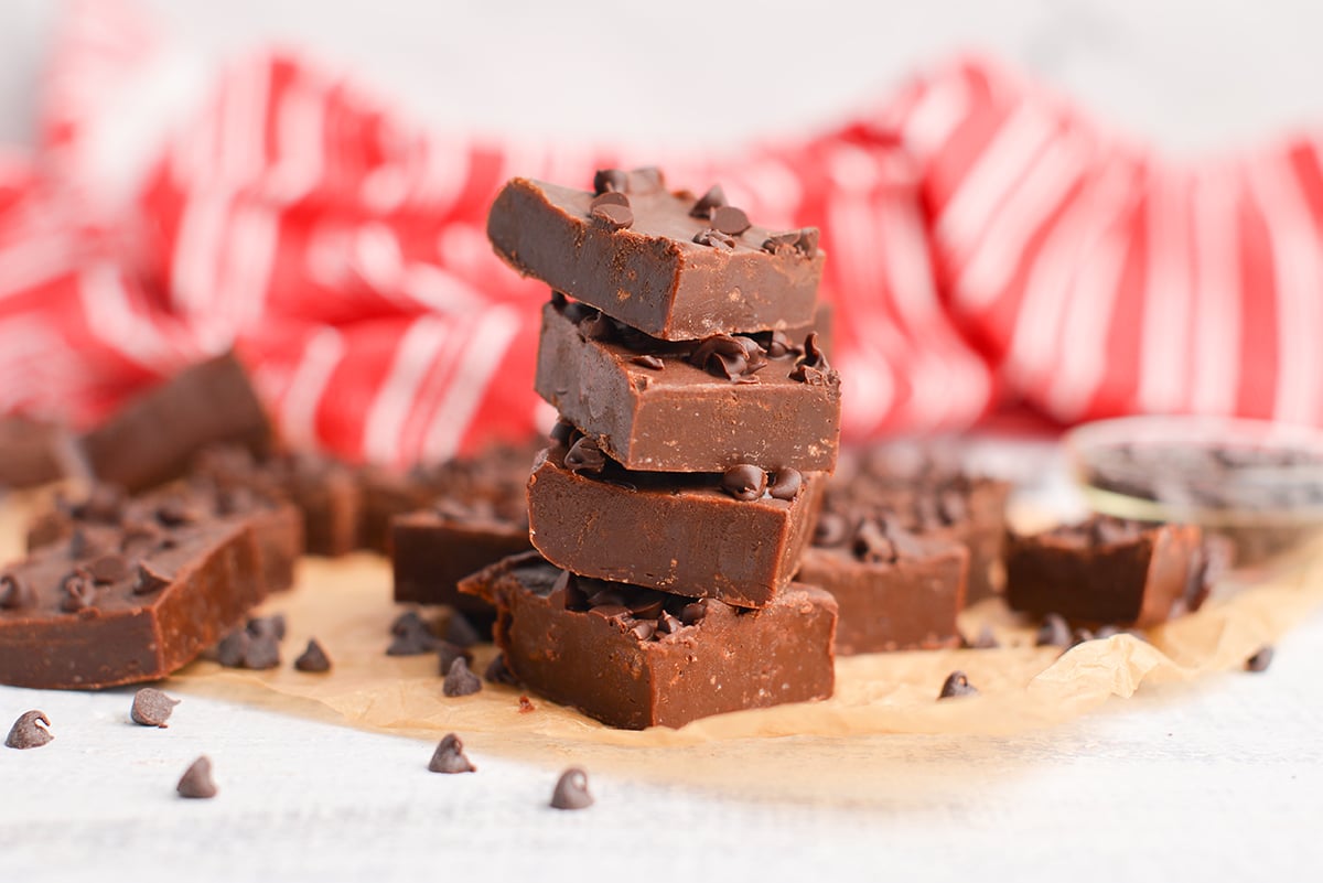 stack of four pieces of chocolate fudge with chocolate chips