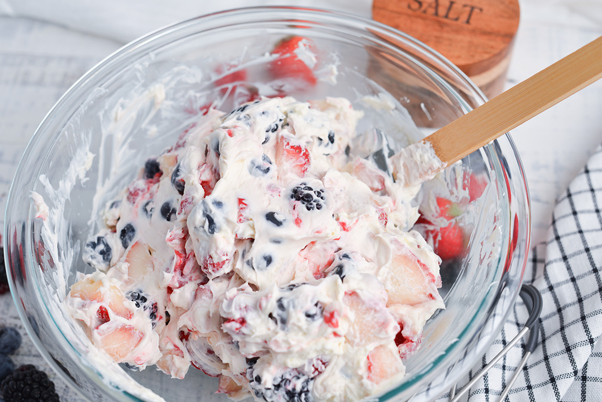 berries and cream combined in bowl