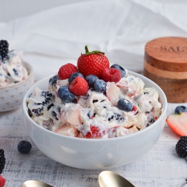 angled shot of berry cheesecake salad in bowl