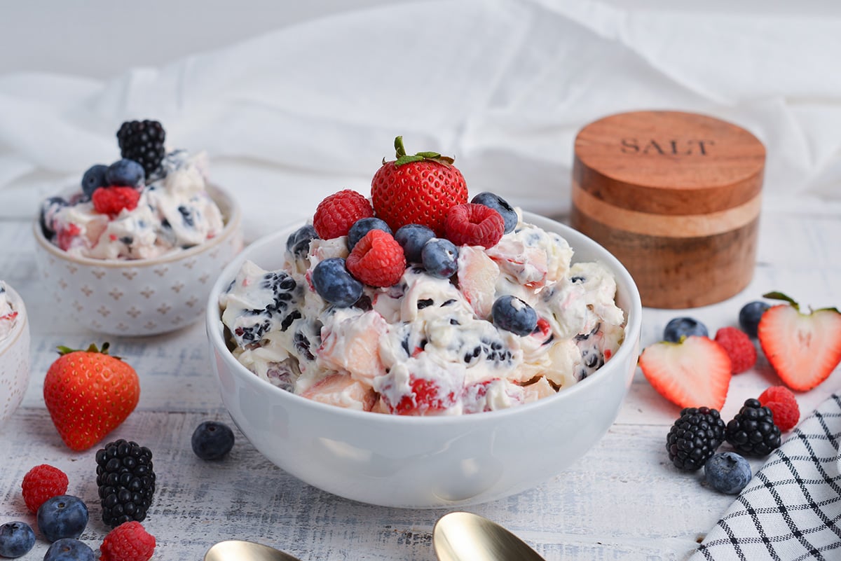 angled shot of berry cheesecake salad in bowl