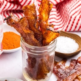 angled shot of jar of candied bacon