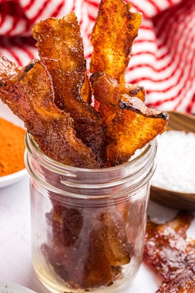 angled shot of jar of candied bacon