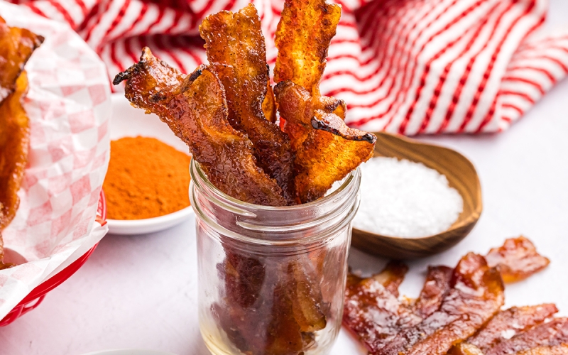 angled shot of jar of candied bacon