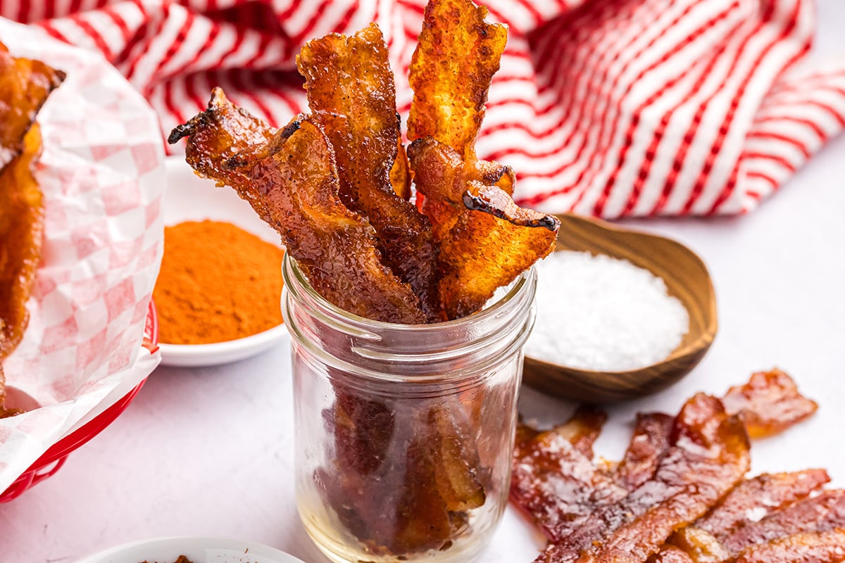 angled shot of jar of candied bacon