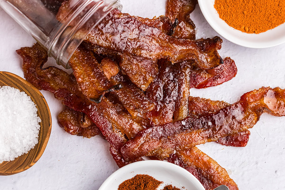 overhead shot of candied bacon poured out of jar