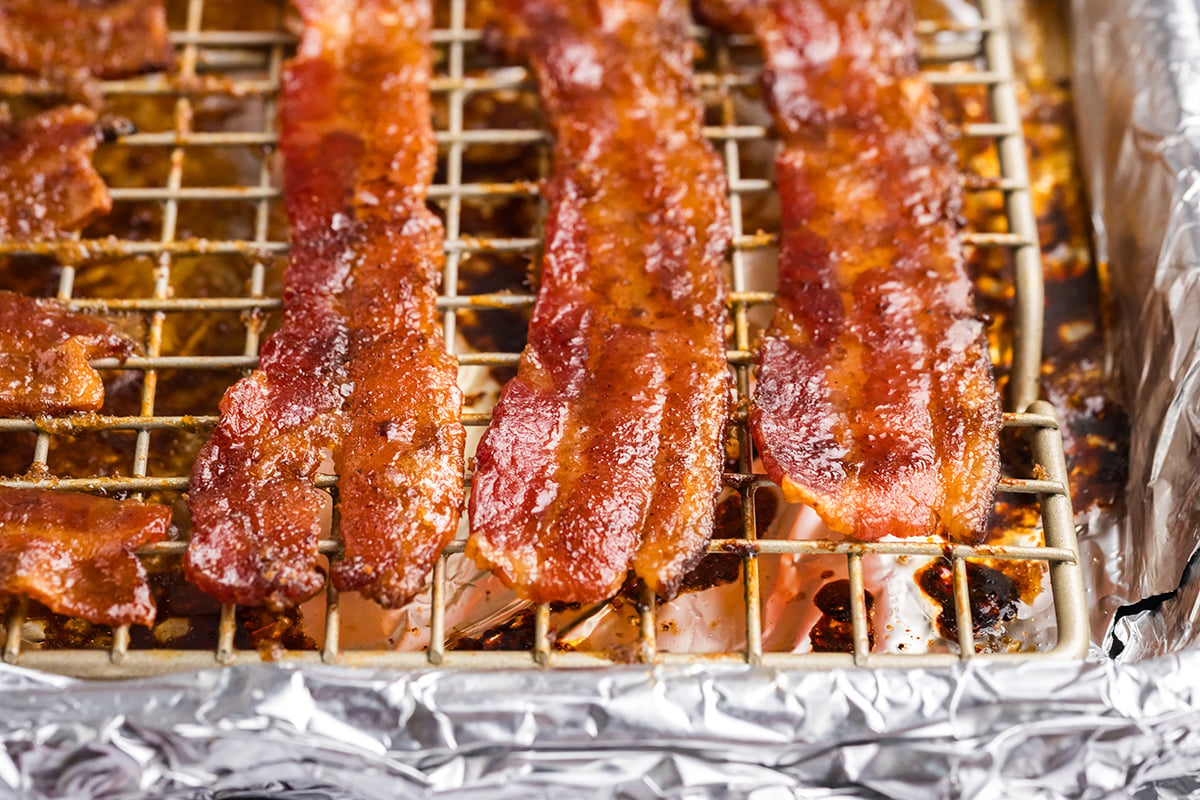 close up angled shot of candied bacon on sheet pan
