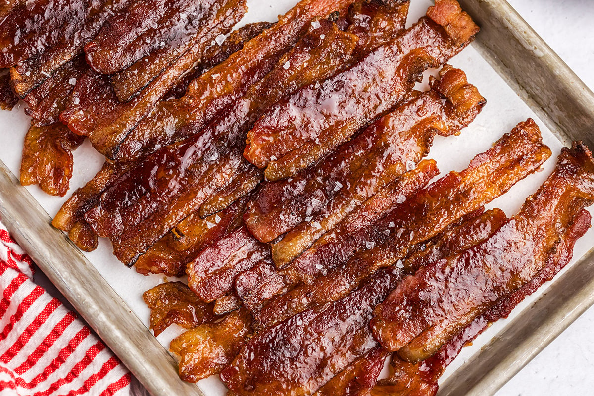 overhead shot of candied bacon on parchment lined sheet pan