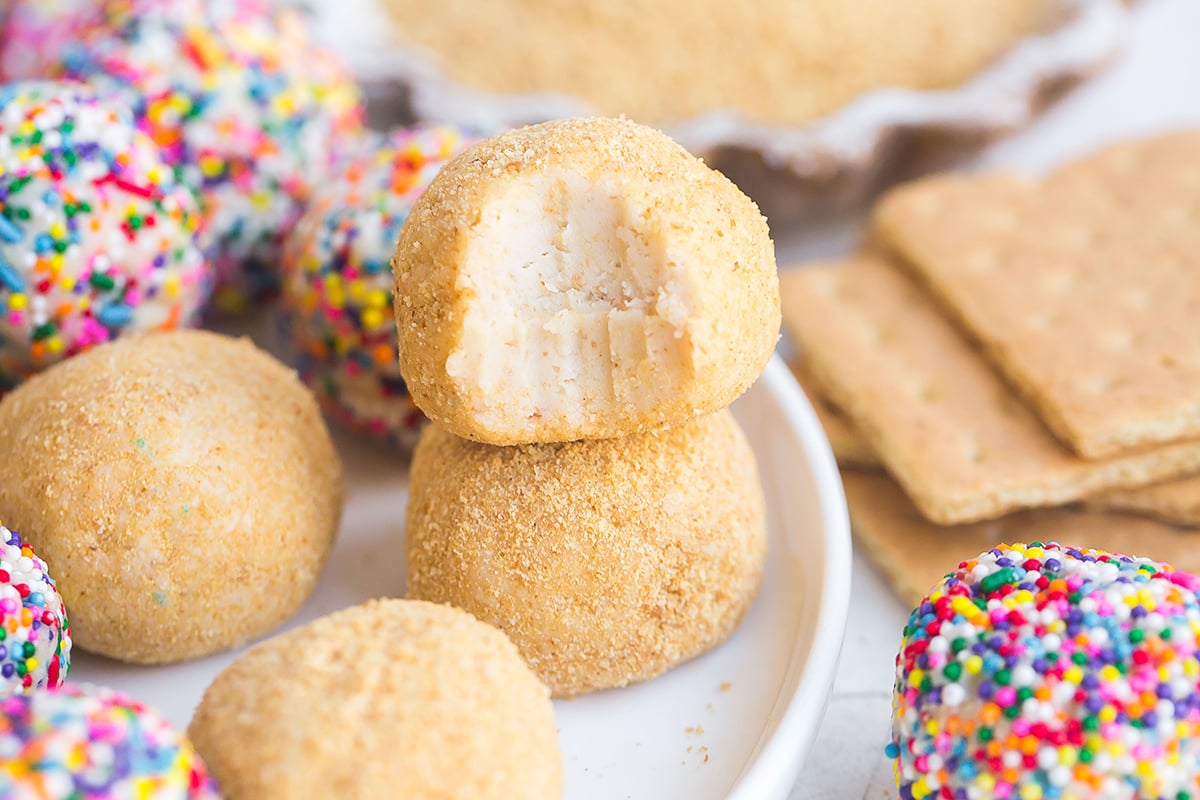 stack of cheesecake balls with one bite taken out