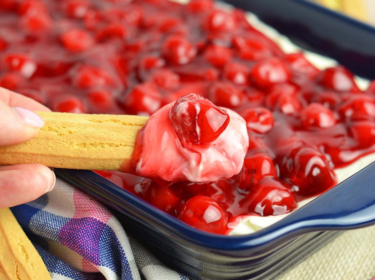 cherry cheesecake dip on a lady finger cookie