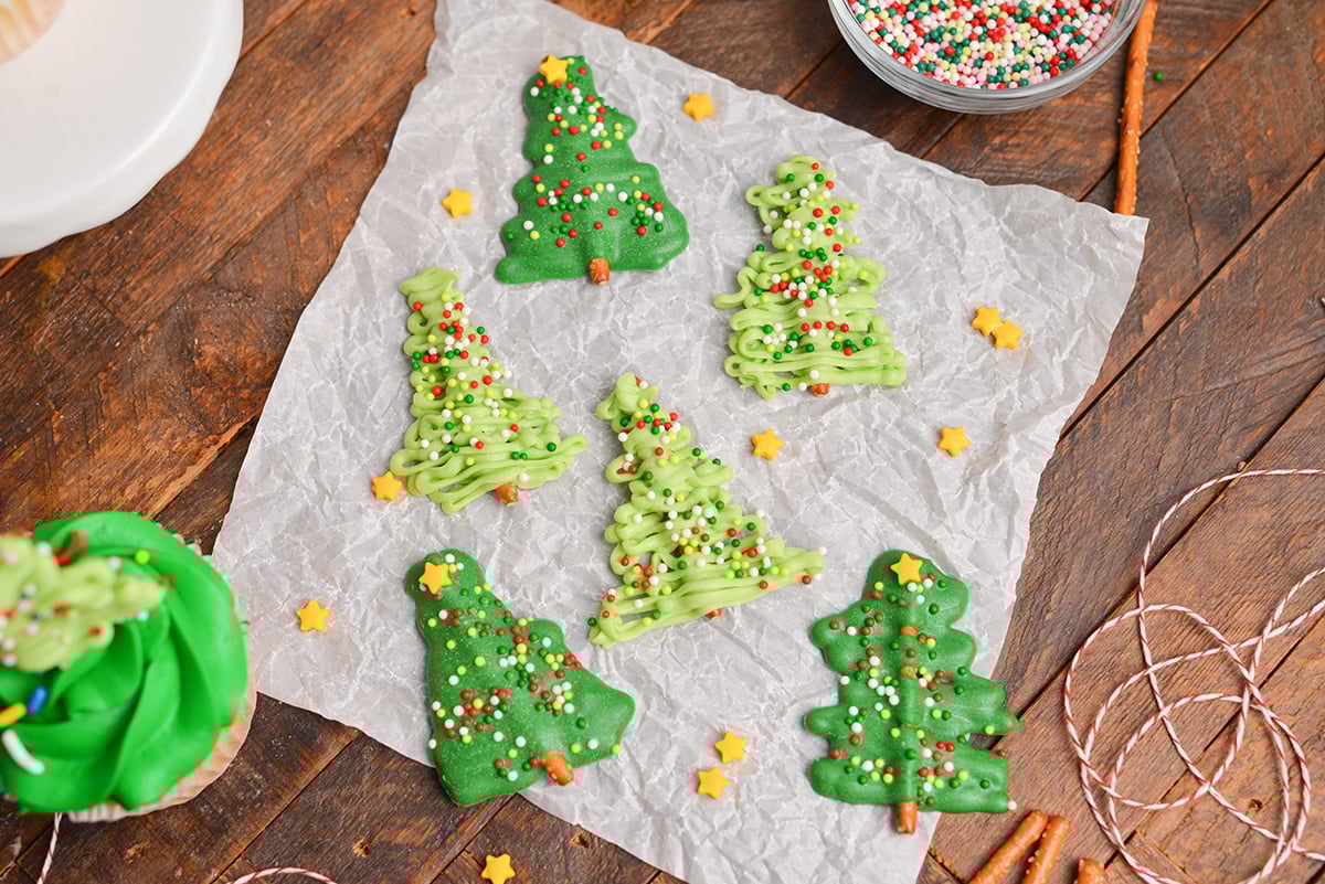 six chocolate christmas trees on parchment paper