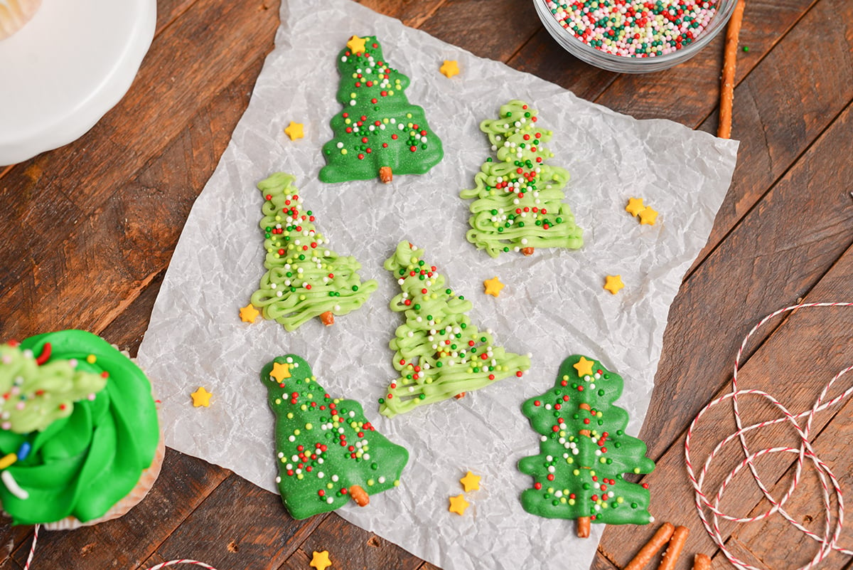 six chocolate christmas trees on parchment paper