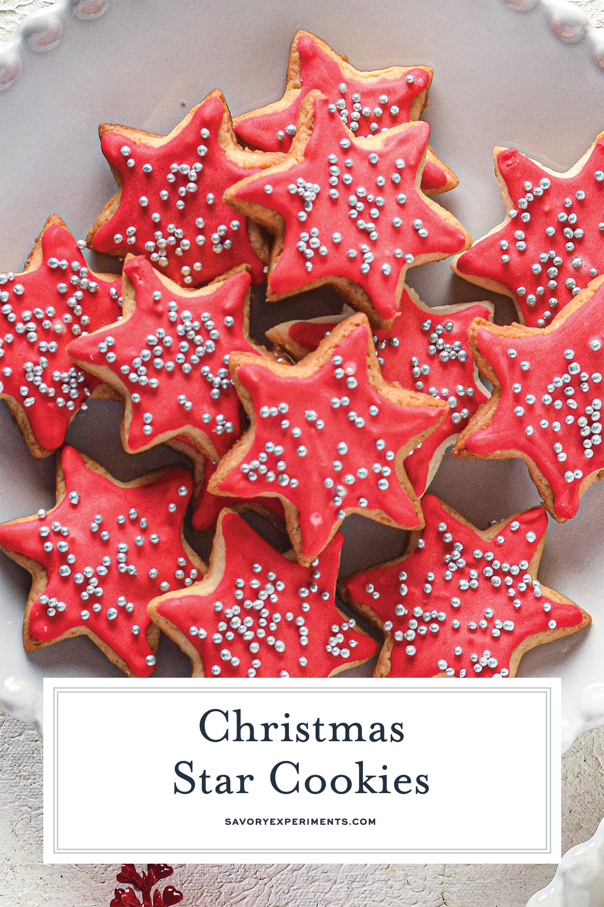 plate of red frosted sugar cookies for pinterest