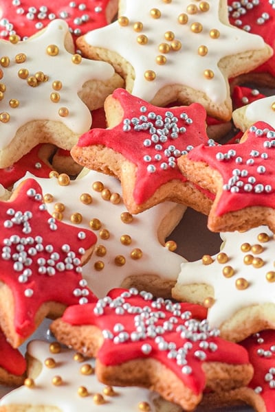 plate of christmas star cookies with silver and gold sprinkles