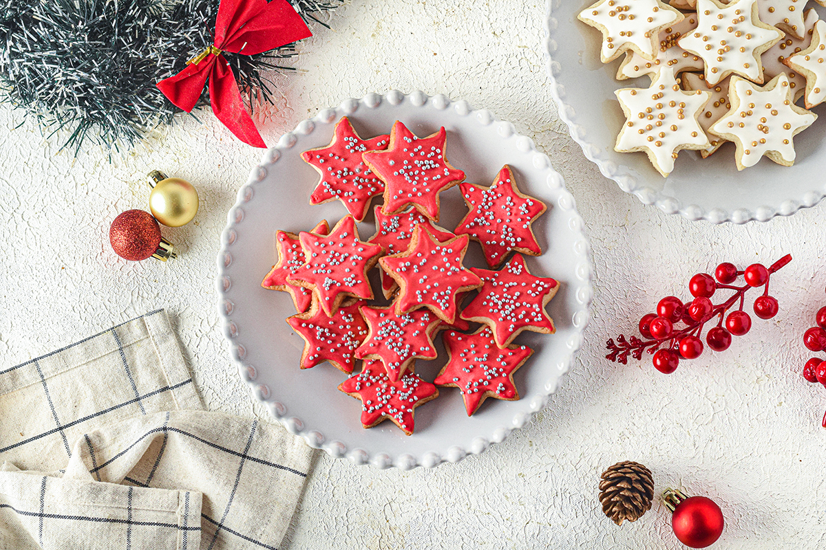 overhead plate of red frosted star cookies