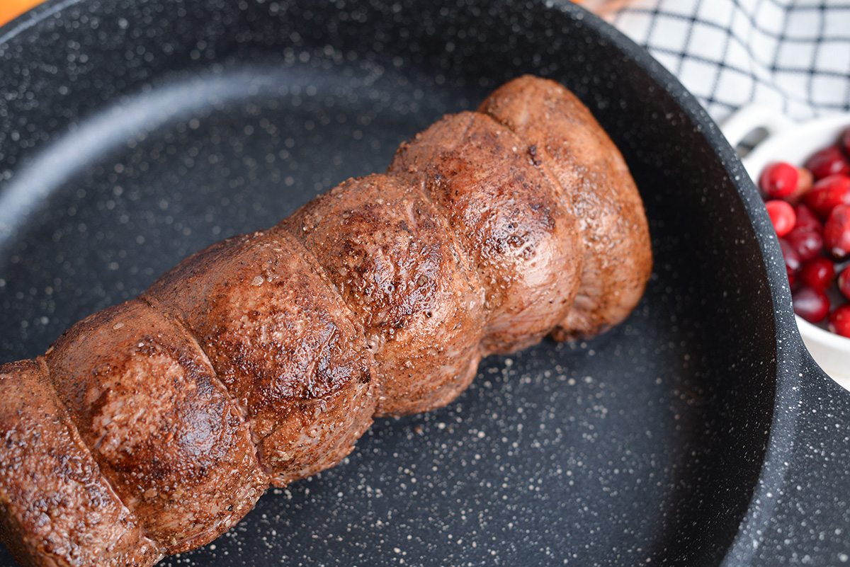 browned beef tenderloin roast in a saute pan