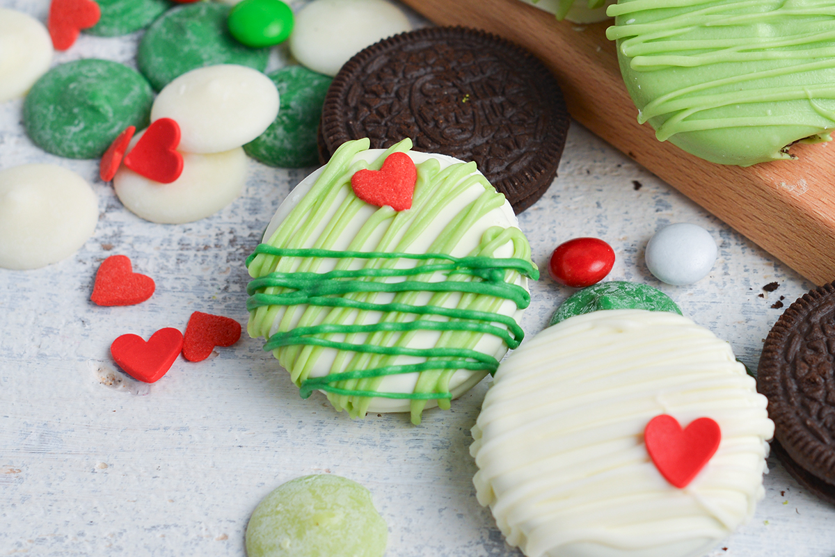 close up overhead shot of chocolate covered oreo drizzled with green chocolate