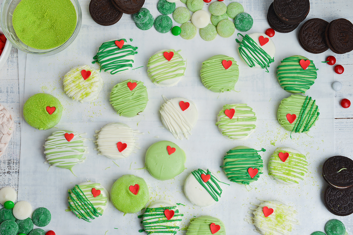 overhead shot of grinch cookies on parchment paper