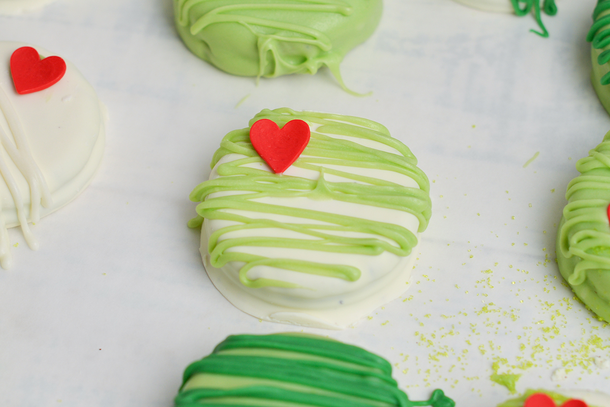 close up angled shot of grinch cookie on parchment paper
