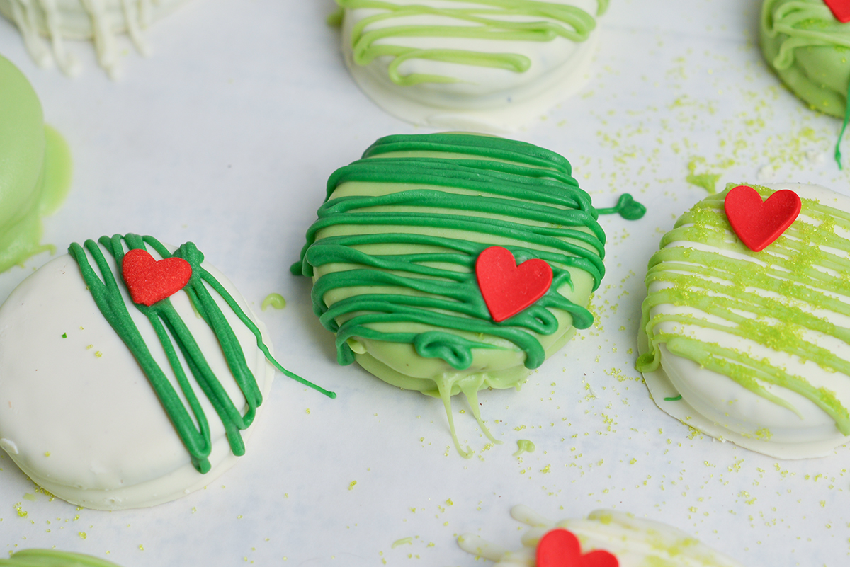 close up shot of three grinch cookies